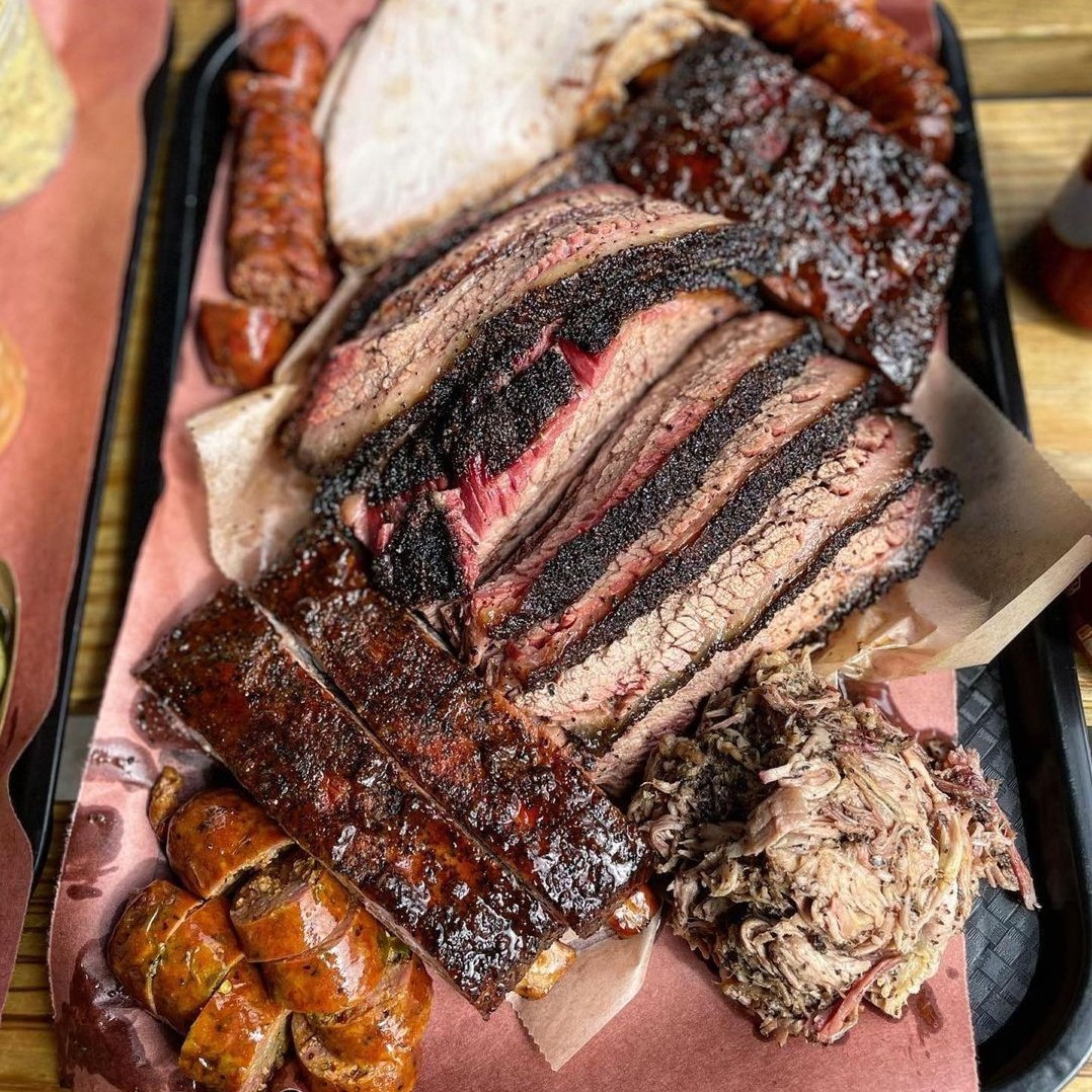 La Barbecue signature dishes Whole Rack Pork Ribs, Whole Brisket, La Chopped.
